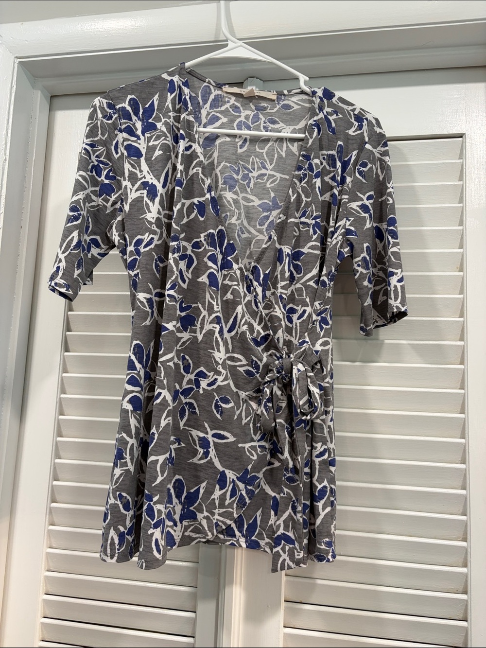 41 Hawthorn Gray Wrap Top with Blue and White Floral Pattern